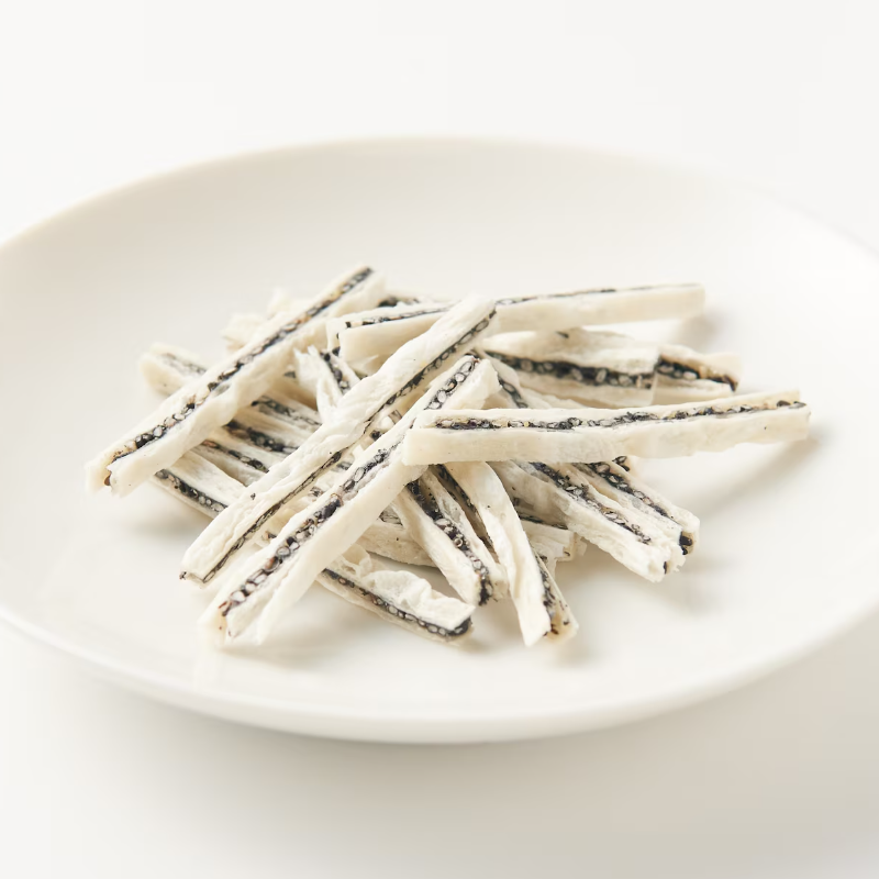 Close up of sesame coated dried fish sheet snack from Japan