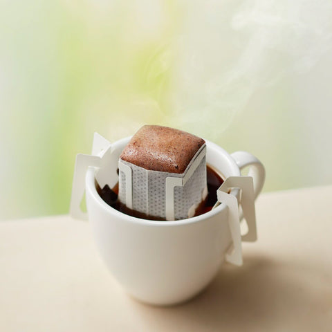 Pouring hot water into Doutor Coffee Drip Pack – brewing process