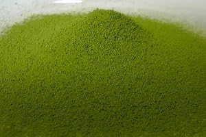 Prepared bowl of Marukyu Koyamaen Ogurayama Usucha matcha with bamboo whisk