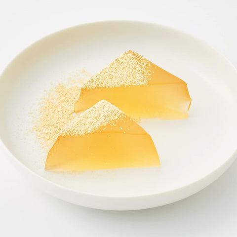 Japanese warabi mochi served with kinako powder during traditional tea time