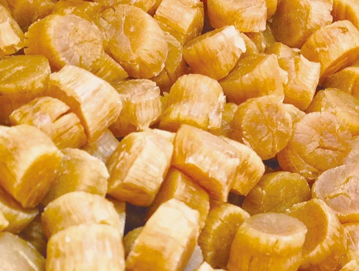 Rehydrated Hokkaido dried scallops being prepared for cooking, showing plump texture