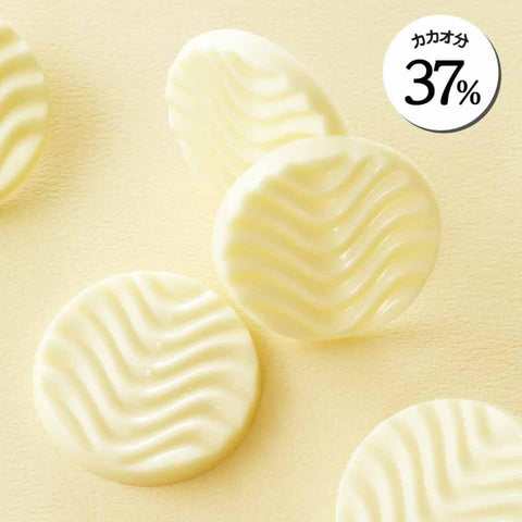 Close-up of ROYCE creamy white chocolate pieces showcasing smooth milky texture