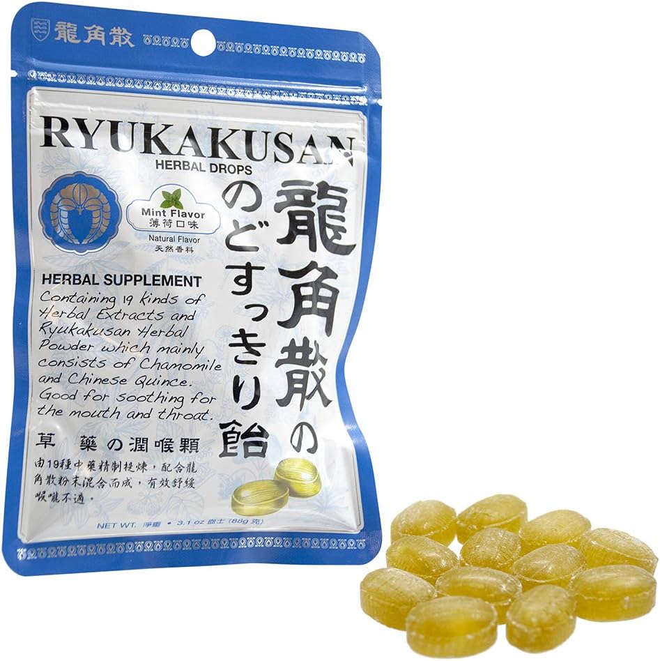 Person enjoying Ryukakusan throat candy for dry throat relief and refreshment