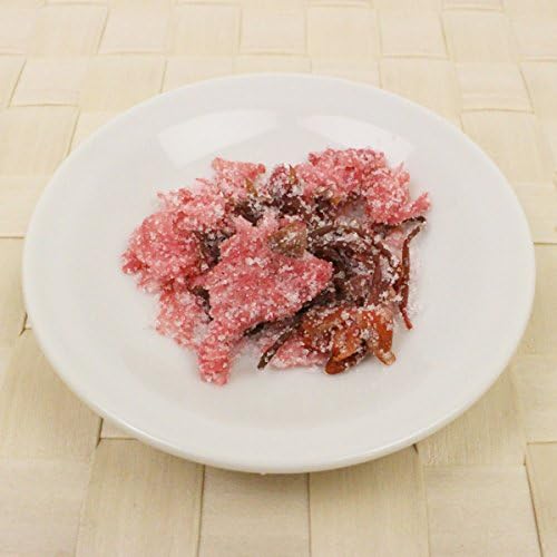 Sakura tea served at Japanese wedding celebration with pink blossoms