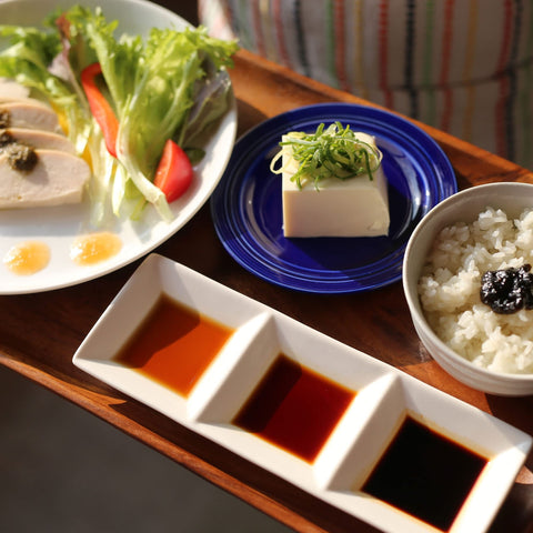 Traditional wooden barrels used by Takesan for raw-pressed soy sauce brewing